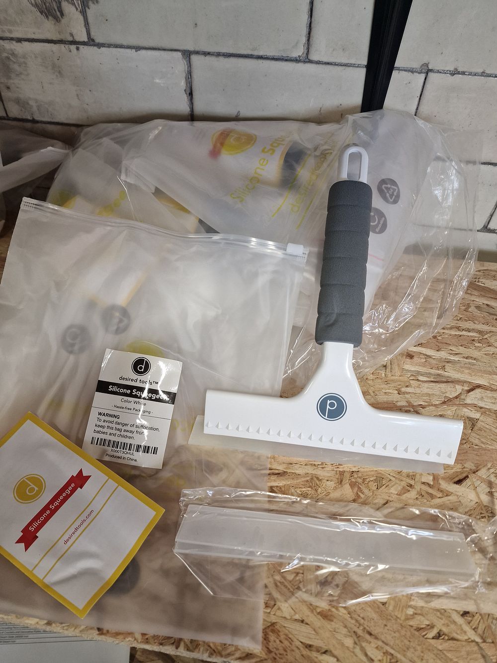 Lot 778: Twn brand new white silicone squeegees