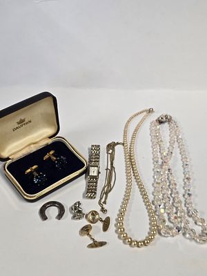 A selection of mens and ladies vintage jewellery. Includes.glass.beads, cuff links and Accurist