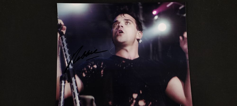 Lot 197: Signed Photo of Robbie Williams with Certificate of Authenticity