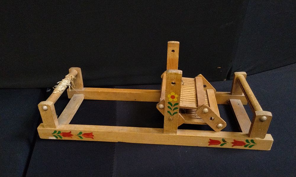 Lot 317: Small decorative wooden weaving loom.