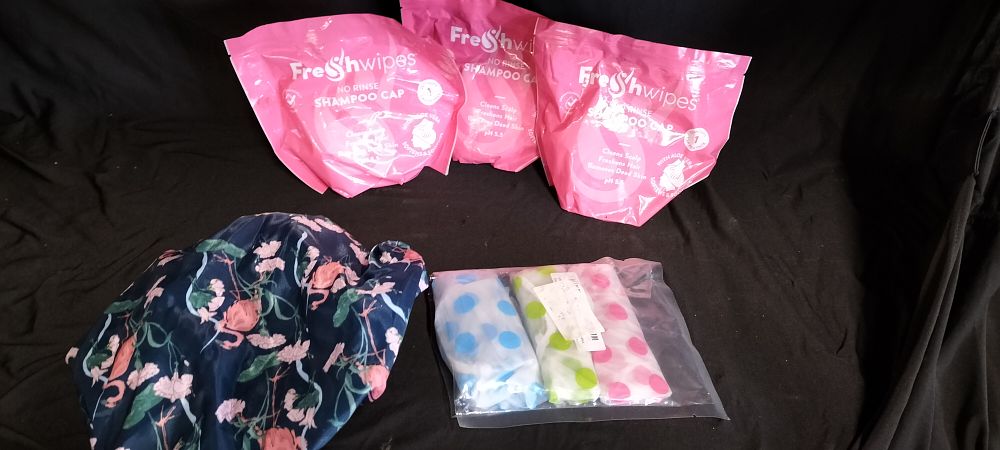 Lot 423: Three No Rinse Shampoo Caps and Four Shower caps