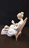 A large Lladro Figurine of Mother Reading. Measures Approx 25.5 x 12.5 x 23 cmImage - 2