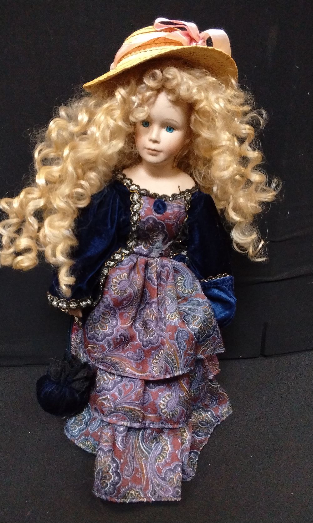 Lot 762: Porcelain Doll on Metal Stand