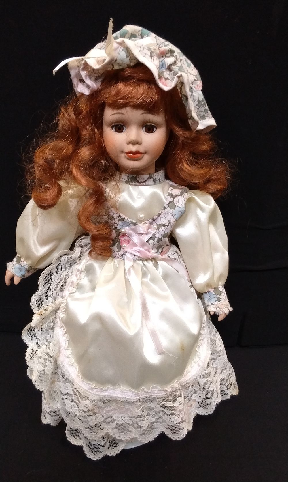 Lot 763: Porcelain Doll on Metal Stand