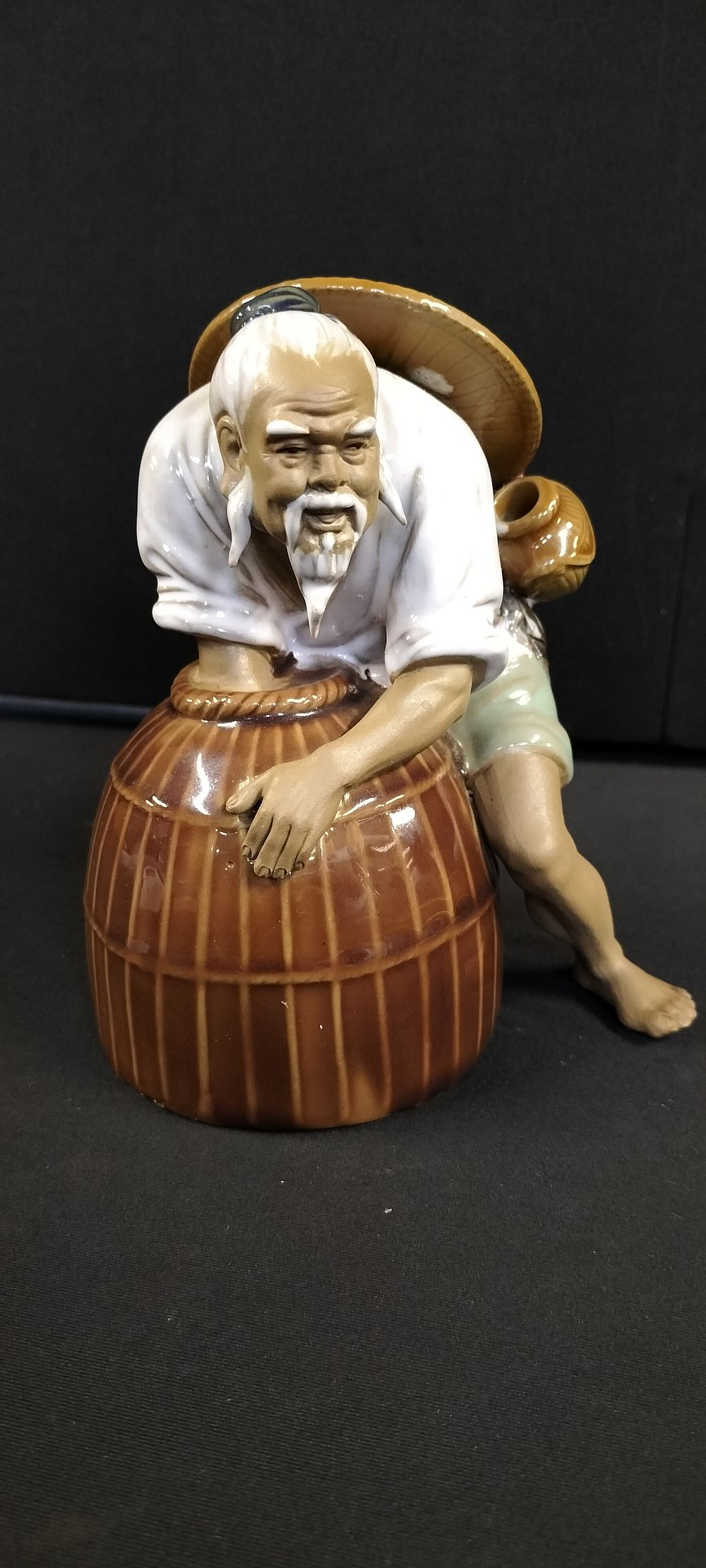 Lot 294: Shiwan Mudman Figurine with Fish Barrel