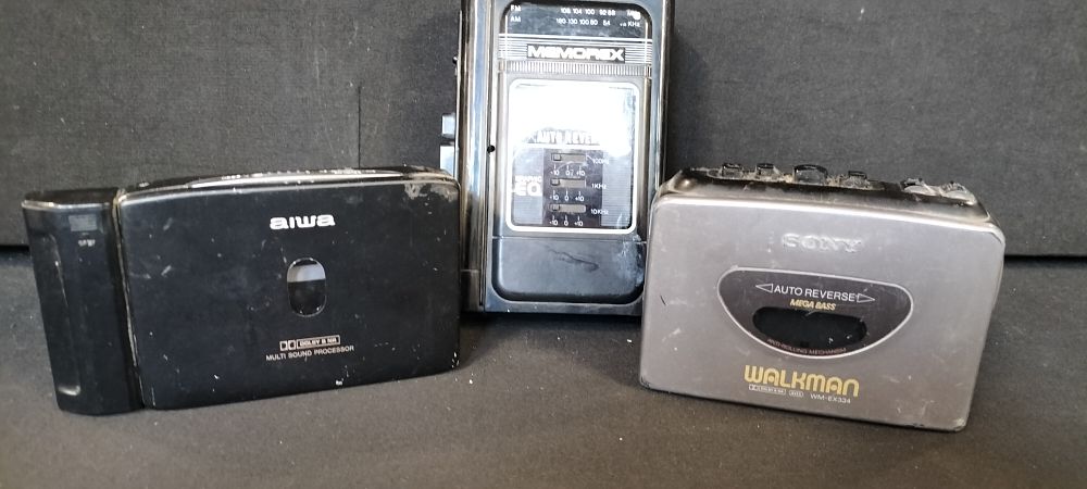 Lot 339: Three Walkmans, 1 Sony Walkman WM-EX334, 1 aiwa HS-PX720 and a Memorex Personal Radio Cassette