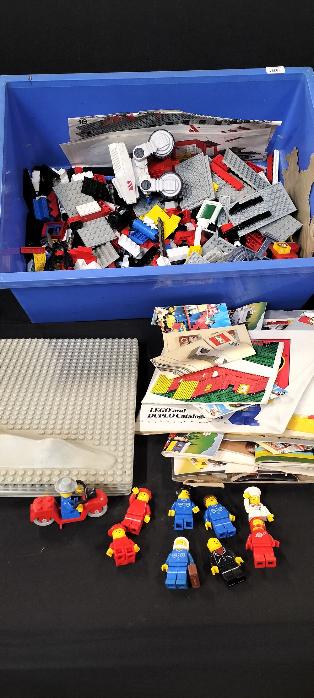 Lot 350: Large Quantity of Vintage Lego Pieces Including Space Baseplates, Figures and some Instructions