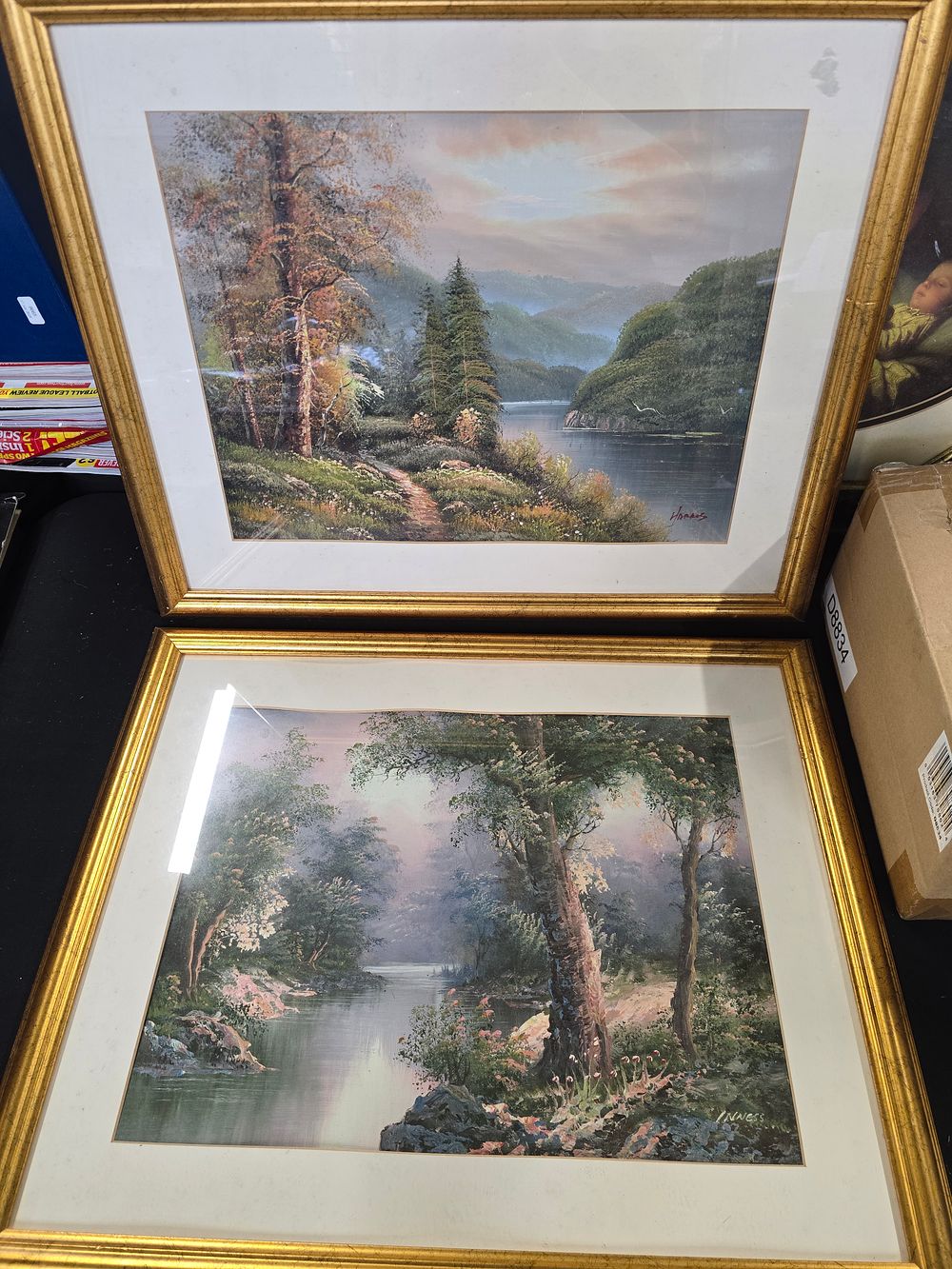 Lot 375: Two brass effect framed pictures of wooden scenes by Harres
