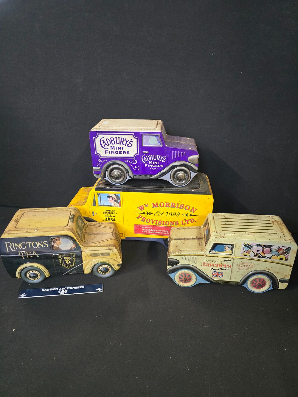 Lot 376: Four vintage advertising van tins