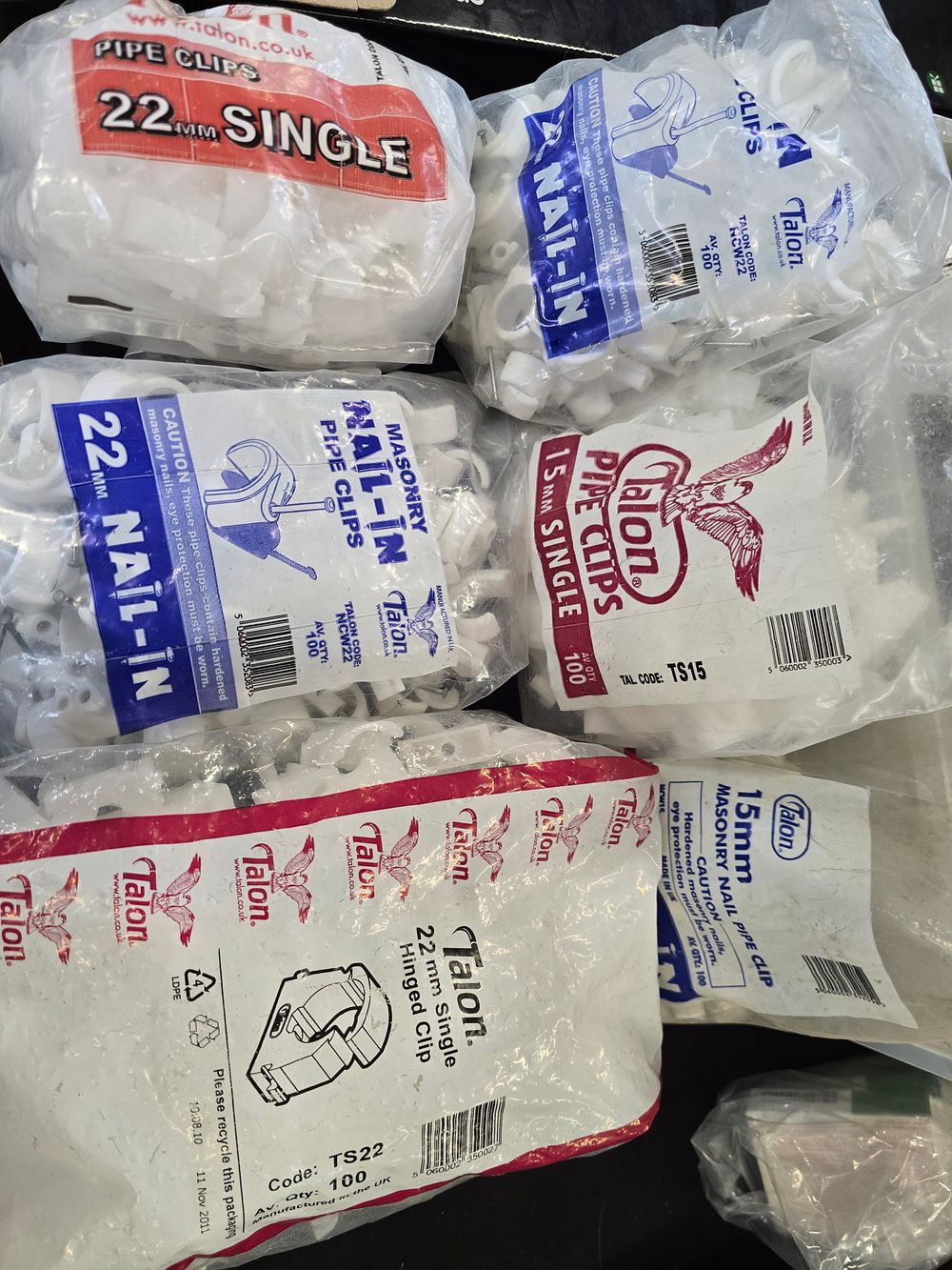 Lot 380: Six bags of Talon pipe clips. Various sizes
