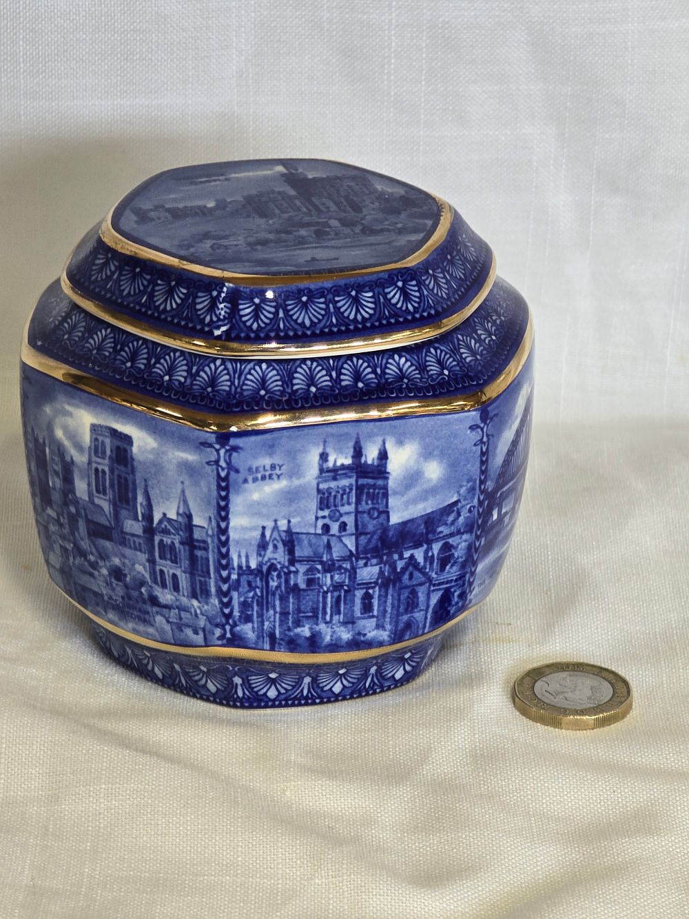 Lot 458: Miniture Ringtons Tea caddy by Wade for the 80th Anniversary