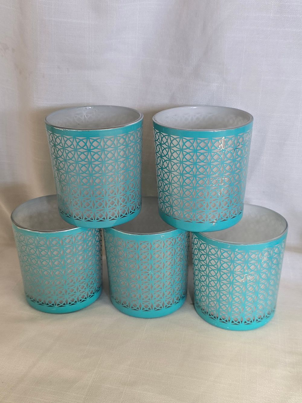 Lot 483: Five glass Yankee candle tea light holders