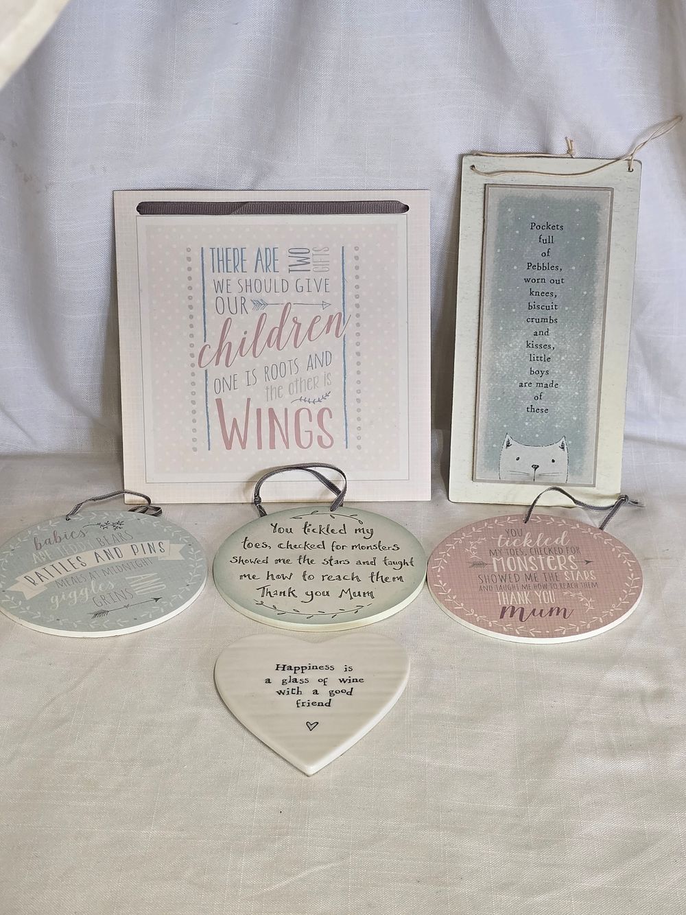 Lot 487: A selection of wooden hanging plaques with says or poems