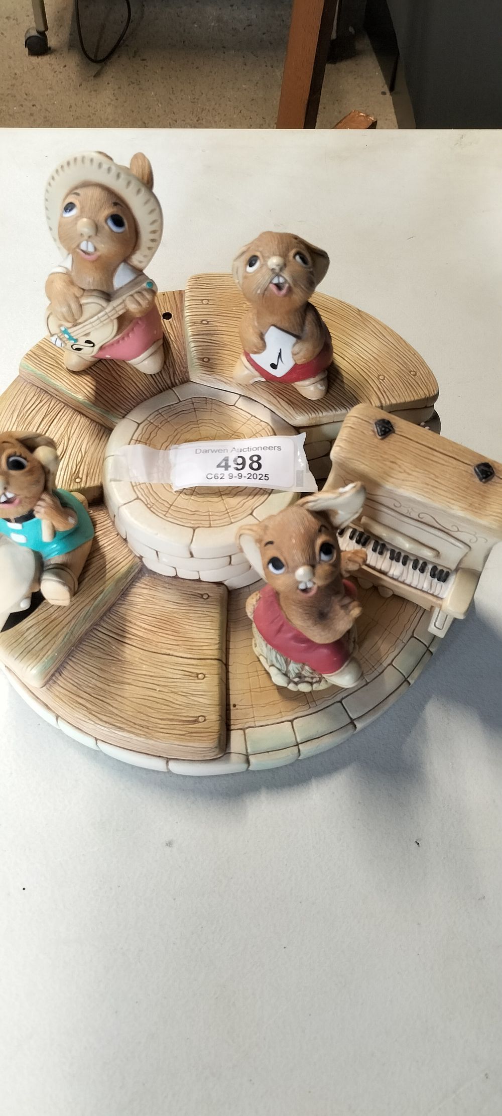 Lot 498: Five Pendelfin Hand Painted Stone craft Figurines on a Display Base