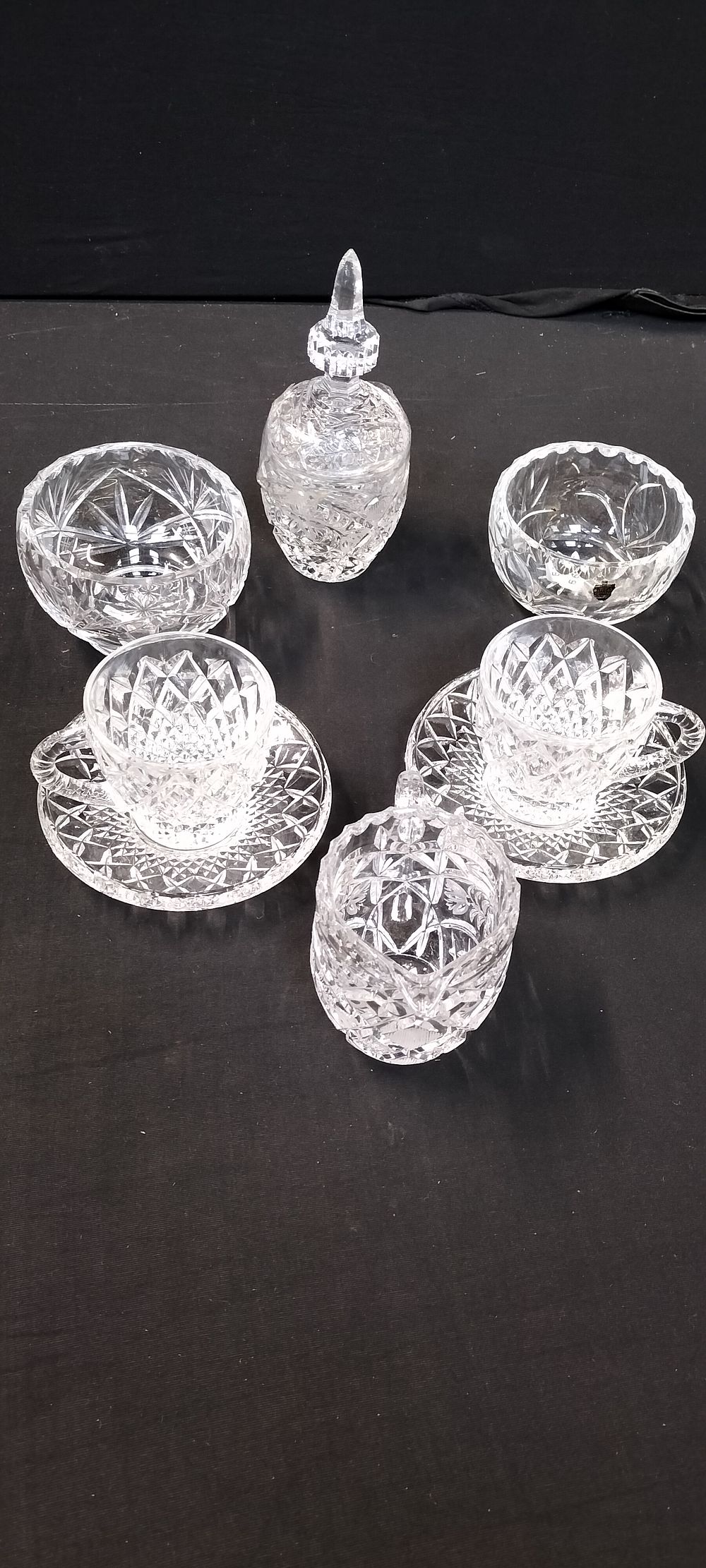 Lot 479: A collection of Cut Lead Crystal Glass Ware, Including Two Bohemian Czechoslovakian Cups and Saucers, a Milk Jug and Watford Crystal