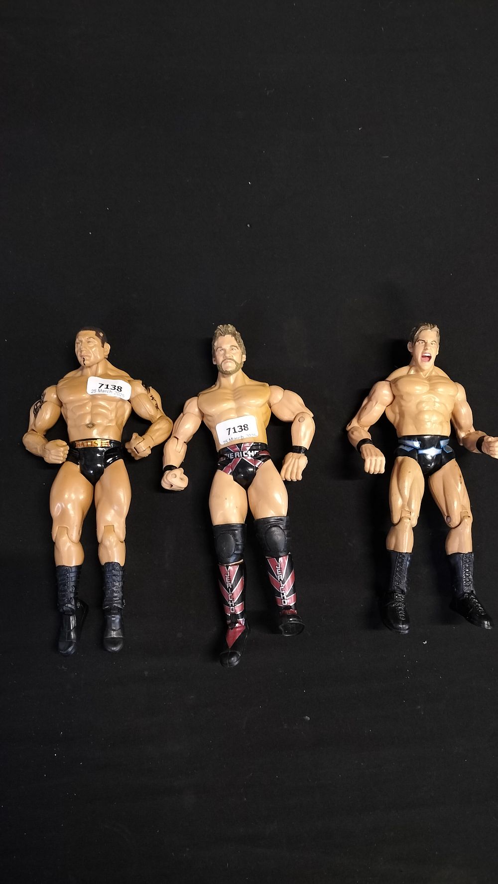 Lot 304: Three WWE wrestling figures 