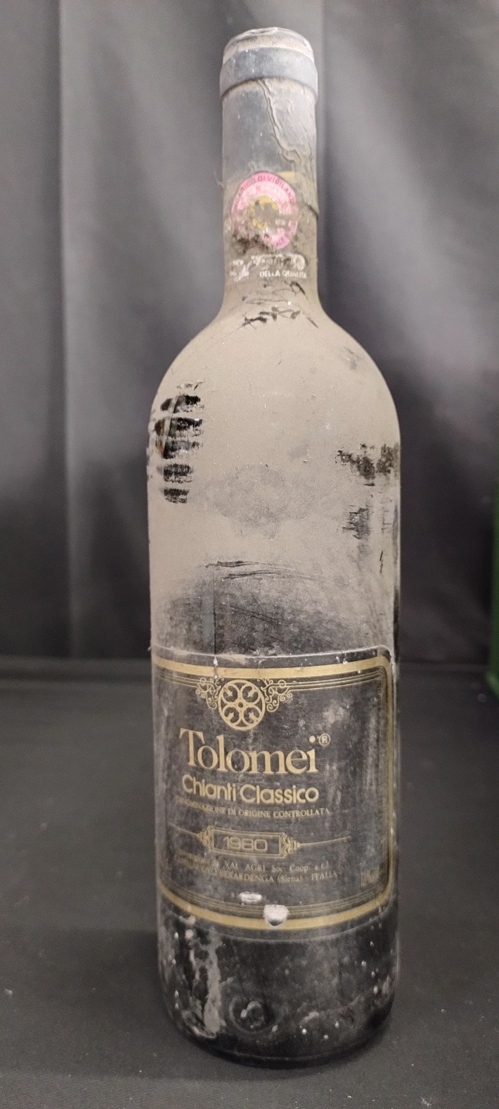 Lot 311: One bottle of unopened red wine. 1983 Tolomei...
