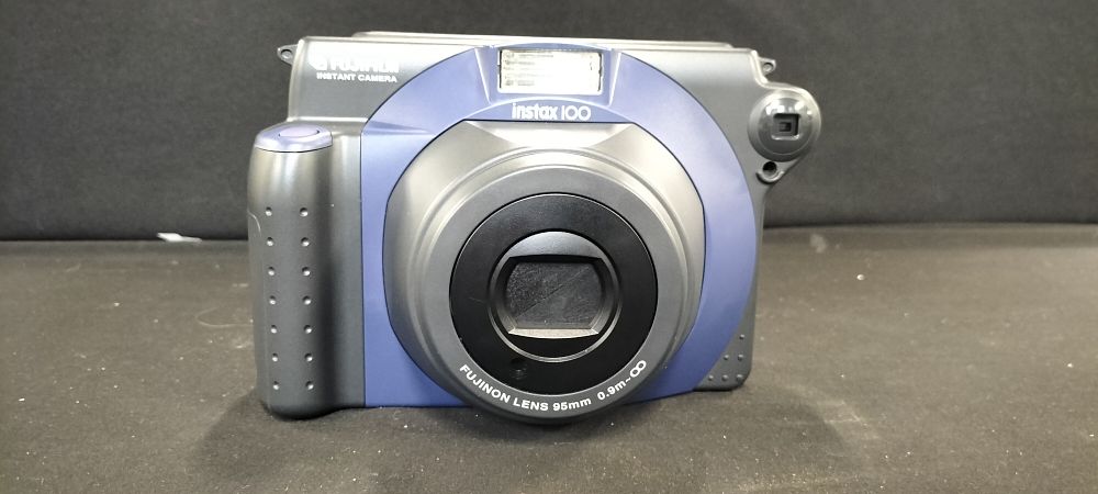 Lot 213: Fujifilm Instax 100 Instant Camera with Film Pack