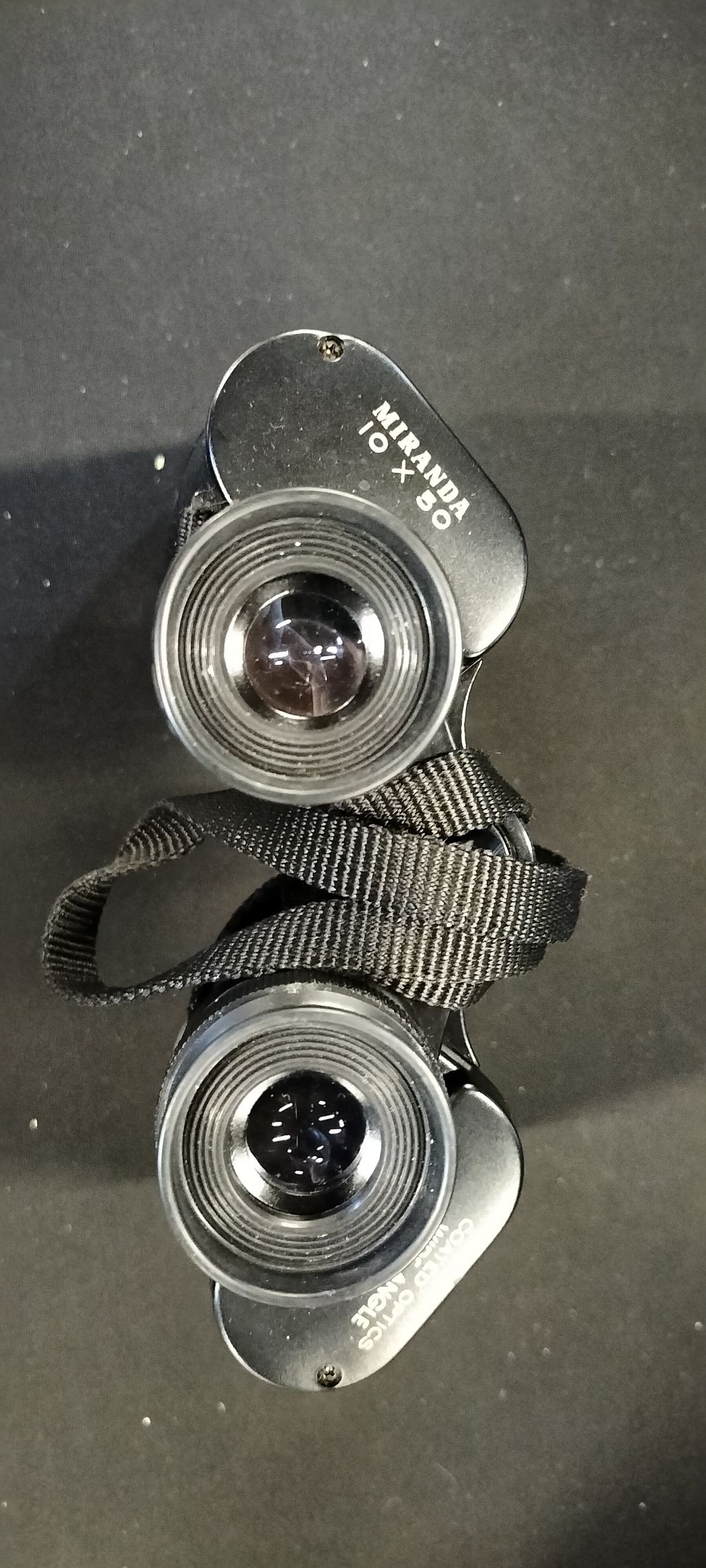 Lot 241: A Pair of Miranda 10x50 Coated Optics Binoculars in a black case.