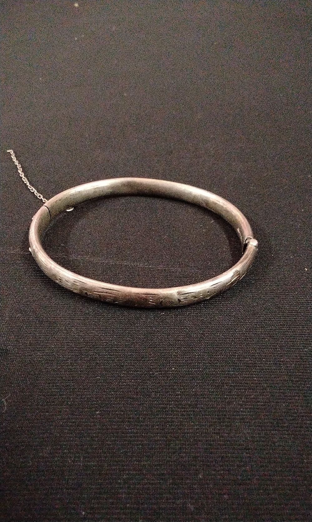 Lot 318: A Sterling Silver 925 Etched Bangle Bracelet