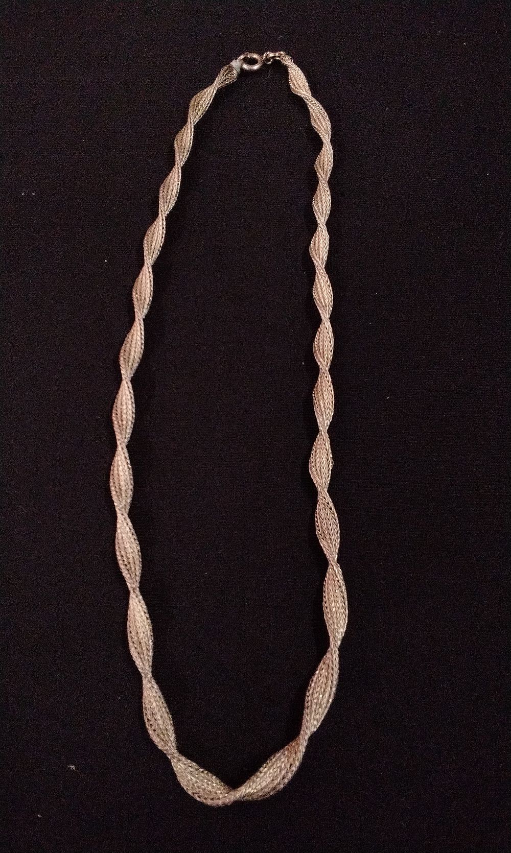 Lot 320: A Silver-Colored Braided and Twisted Necklace