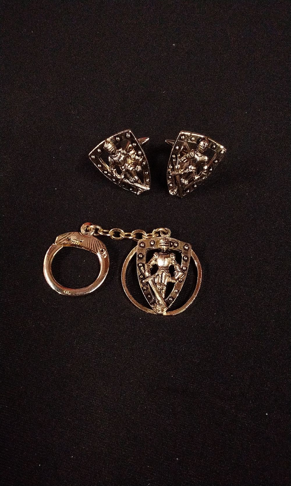 Lot 340: A Pair of Gold-Toned Knight Cufflinks and Matching Keychain