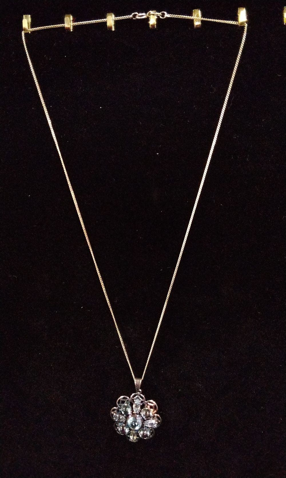 Lot 344: A Sterling Silver Necklace with Flower Pendant and Stones