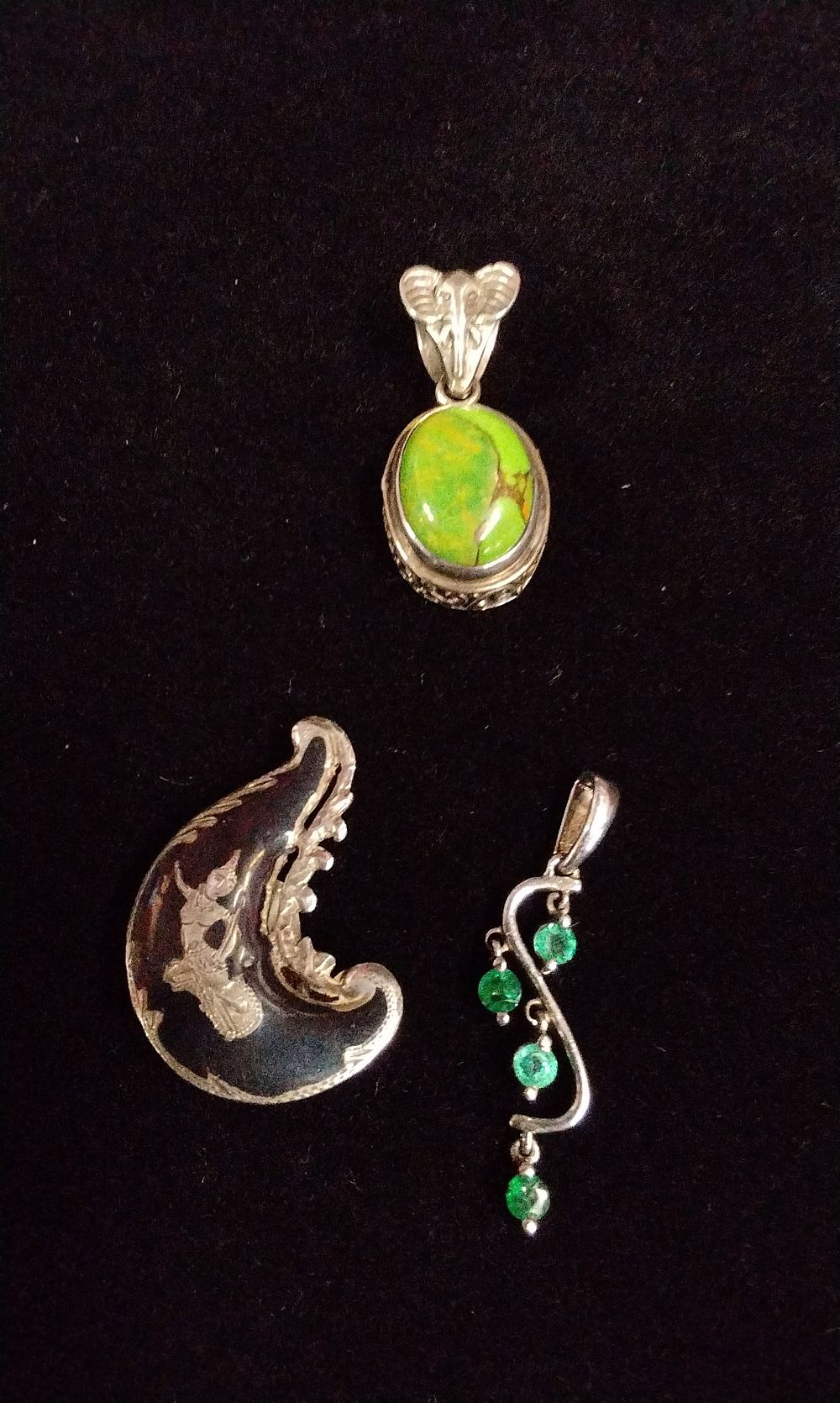Lot 346: Three Sterling Silver Green Gemstone Pendants