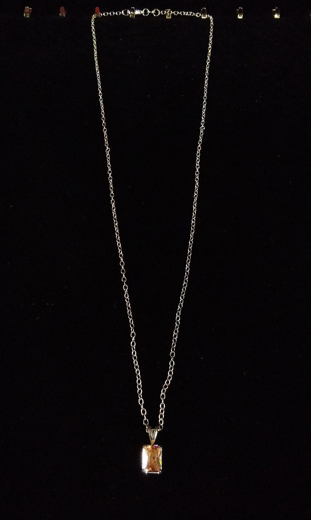 Lot 362: 925 Silver Necklace with Peach/Champagne Gemstone Pendant