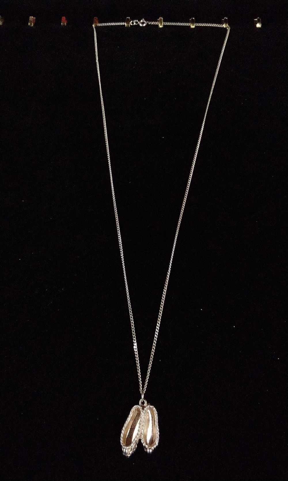 Lot 366: A Silver-Toned Necklace with Ballet Slipper Pendant