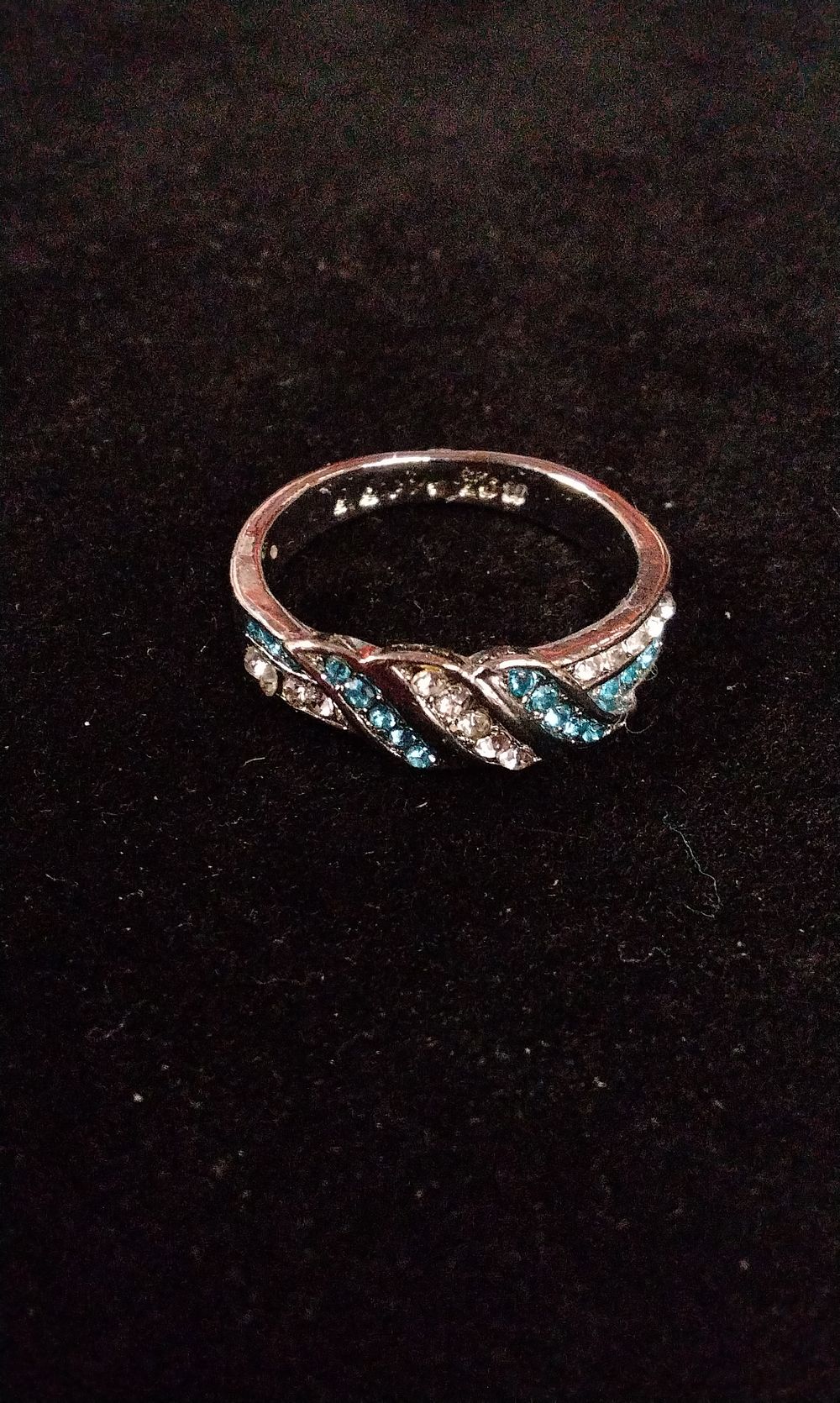 Lot 367: Silver Tone Wave Ring with Blue and Clear Stones and I Love You Inside the Ring. Size P