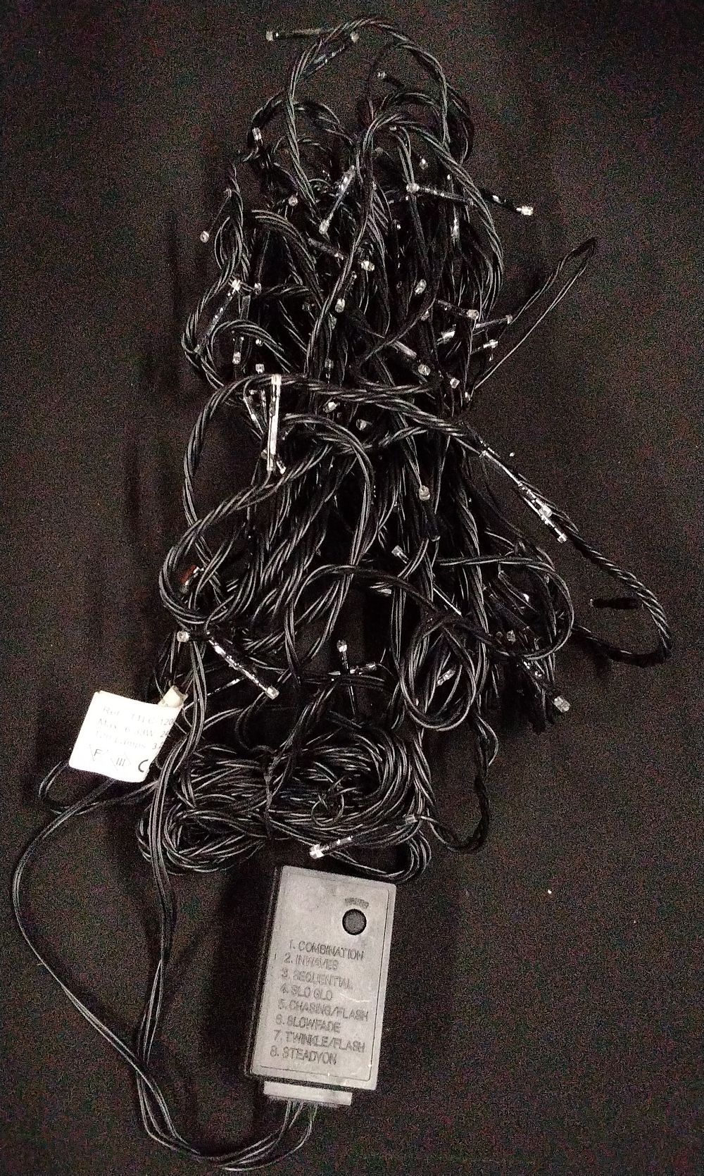 Lot 376: A Set of Black String Lights with Clear Bulbs