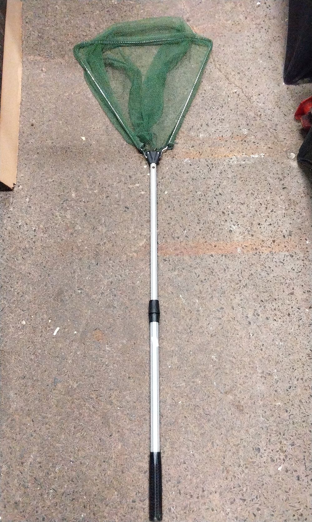 Lot 386: A Green and Silver Collapsible Fishing Landing Net