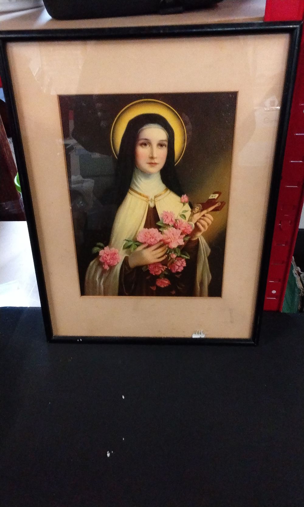 Lot 388: A Framed Print of Saint Thérèse of Lisieux. Measures Approx 38x38 cm
