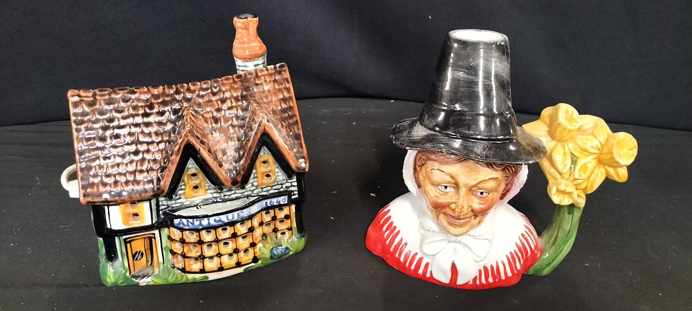 Lot 290: A Pair of Ceramic House Model and Character Jug
