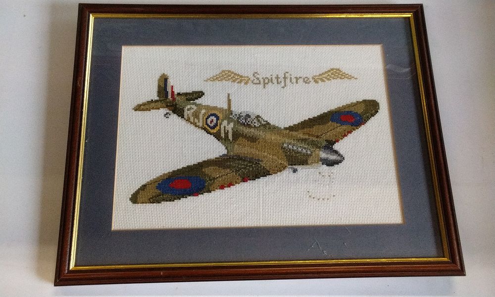 Lot 156: Framed Cross-Stitch Artwork of a Spitfire Airplane