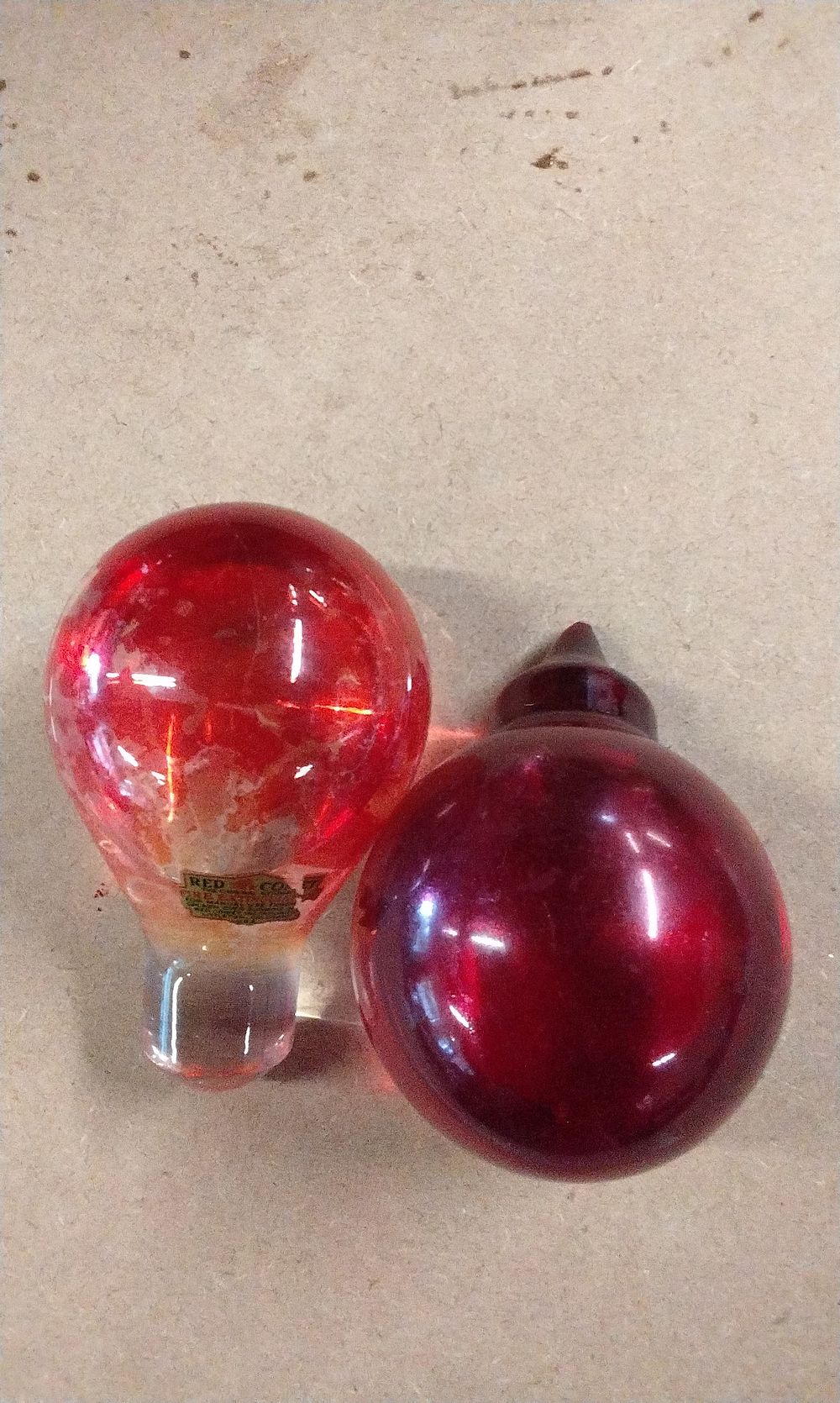 Lot 183: A Pair of Red Glass Red Coat Fire Extinguisher Bulbs