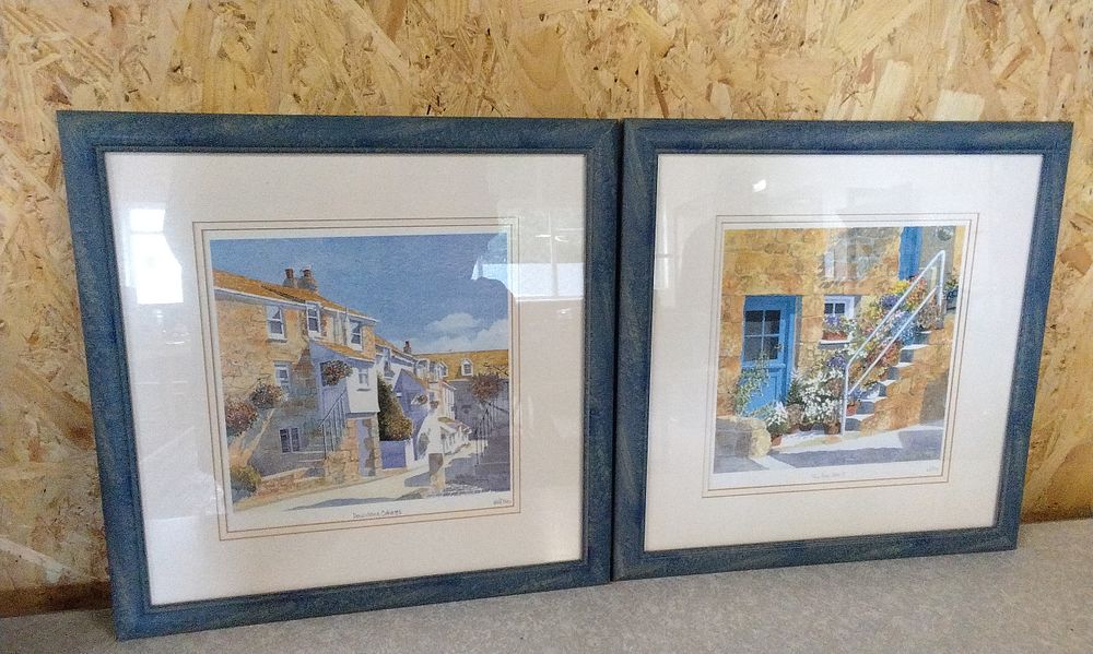 Lot 218: A Pair of Framed Watercolor-Style Rustic Street Scene Prints by Witom