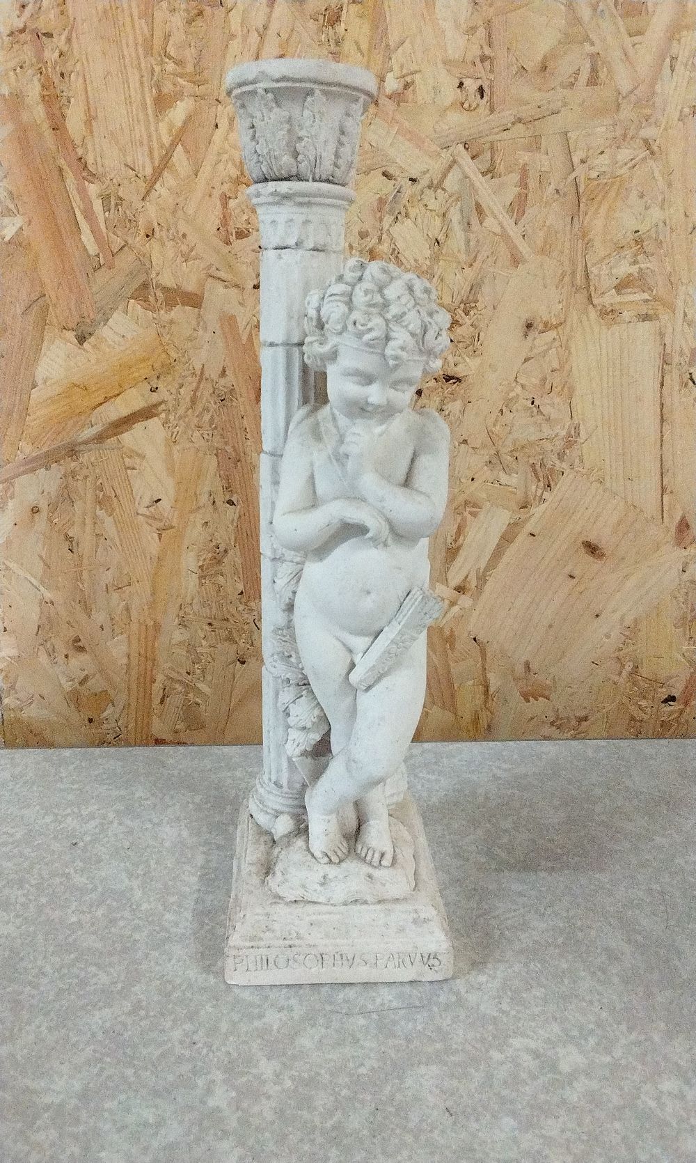 Lot 223: A Classical Cherub 'Philosophus Parvus' Candle Holder