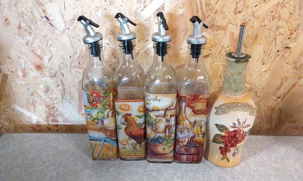 Lot 224: A Set of Five Decorative Oil or Vinegar Dispenser Bottles