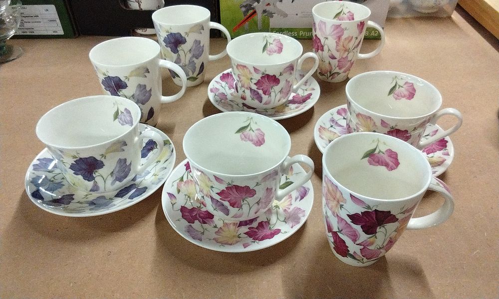 Lot 228: A Set of Roy Kirkham Floral China Cups, Saucers, and Mugs