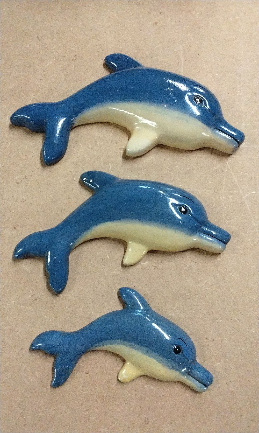 Lot 232: Three  Ceramic Dolphin Figurines