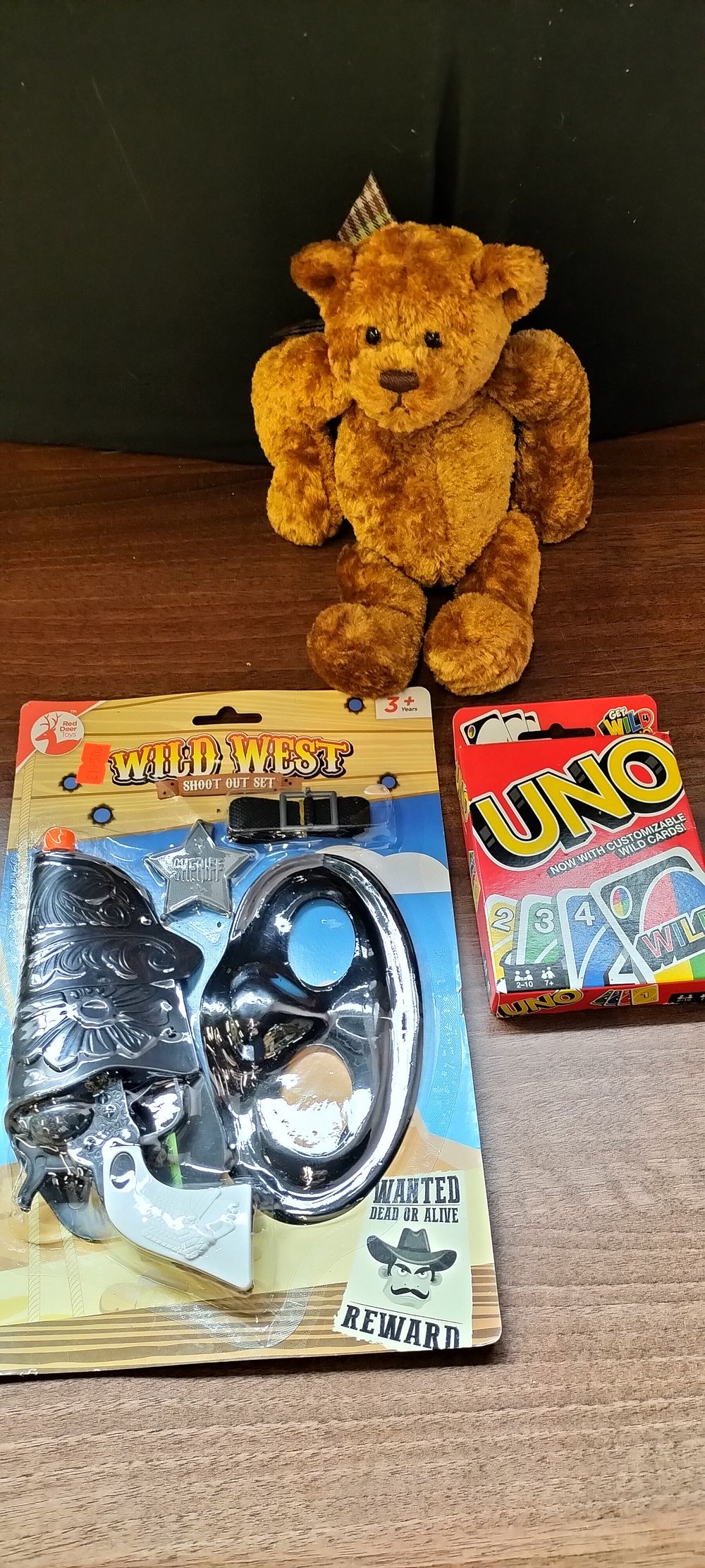 Lot 258: A Wild West Set, Gund Bear, and UNO Cards