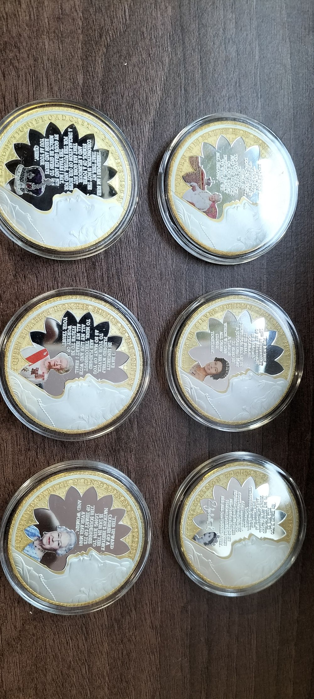 Lot 262: A Set of Six Queen Elizabeth II Gold-Plated Colorized Medals with certificates