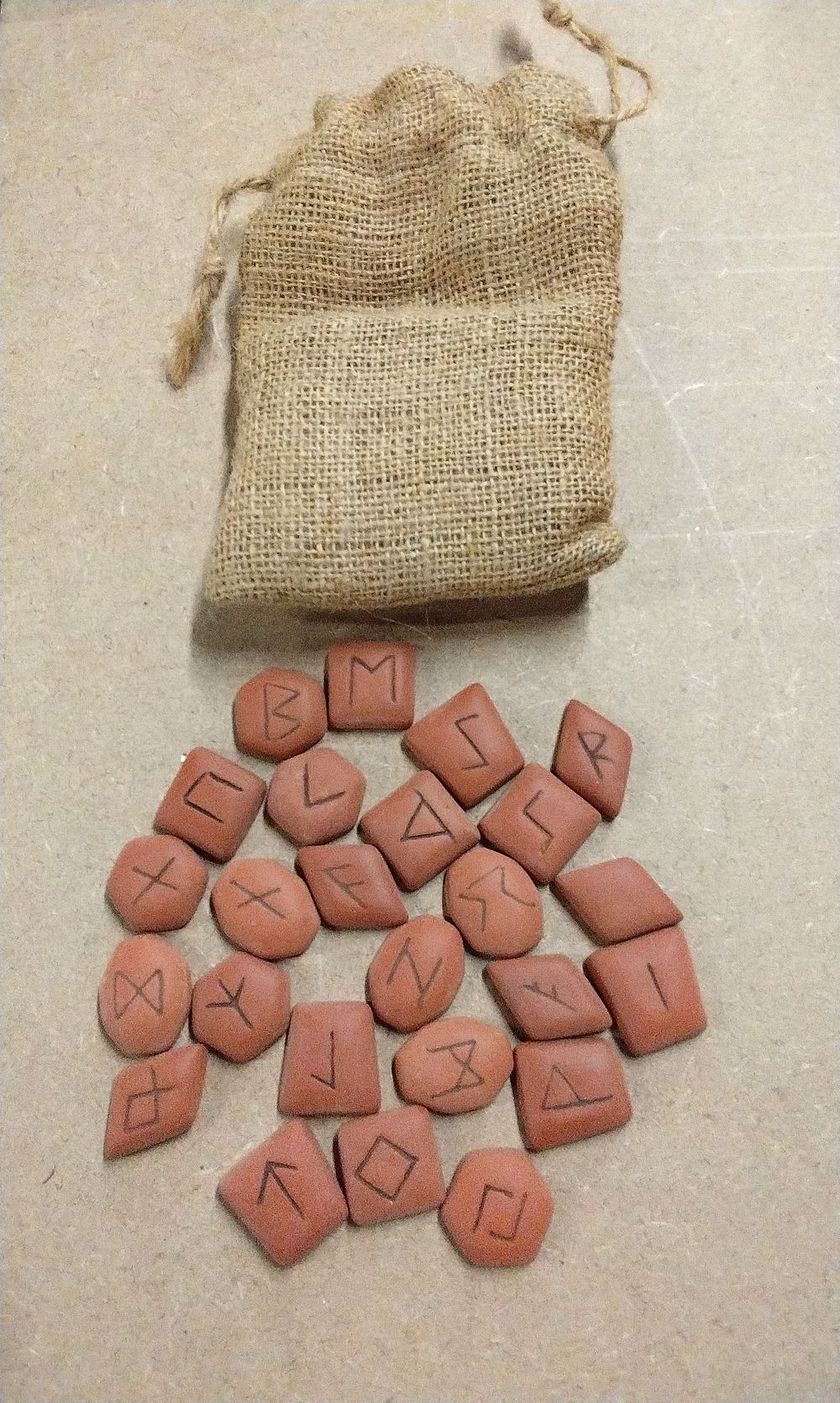 Lot 294: A Set of Modern Terracotta Elder Futhark Runic Tiles with Burlap Drawstring Bag