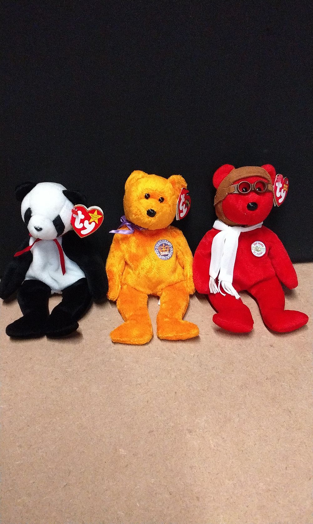 Lot 299: Three Ty Beanie Babies, including 'Bearon' the Aviator Bear, 'Queen's Golden Jubilee' Bear, and a Panda Bear
