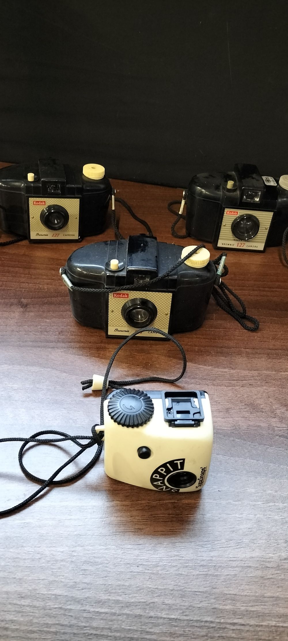 Lot 323: Four Kodak Brownie and Happit Cameras with Medallion