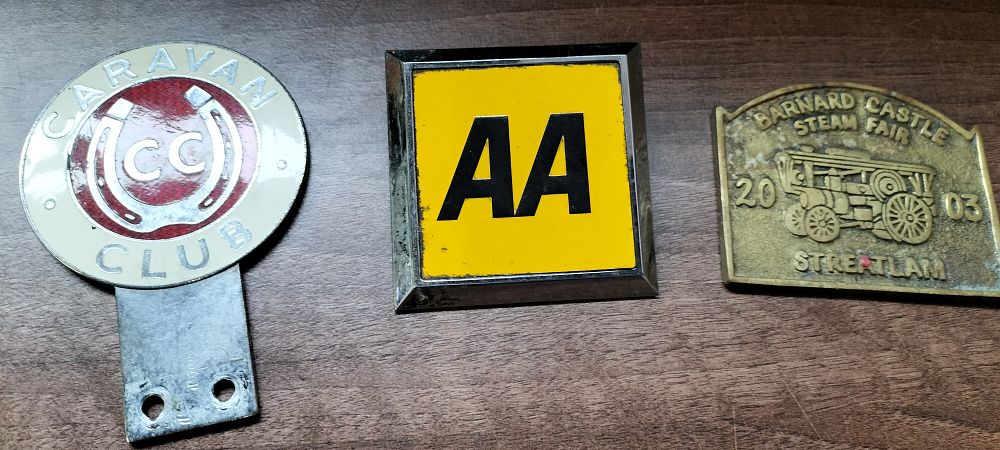 Lot 341: Three Vintage Metal Vehicle Badges and Plaque