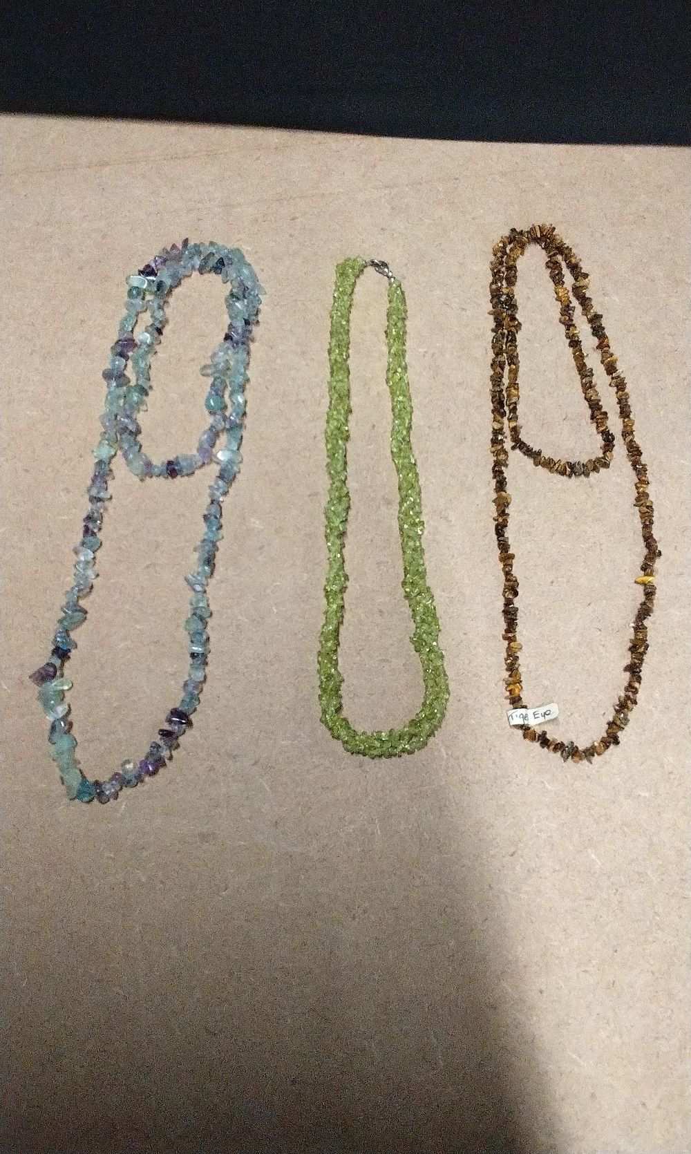 Lot 354: Three Natural Stone Necklaces, Including Peridot and Tiger's Eye
