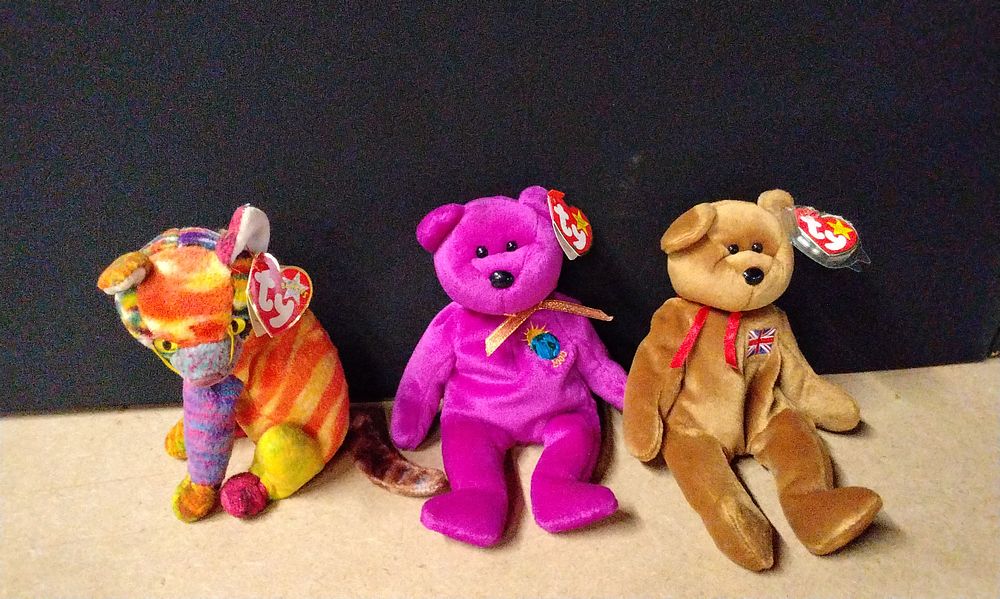 Lot 356: Three Ty Beanie Babies, including 'Millennium the Bear', a striped cat, and a Union Jack bear